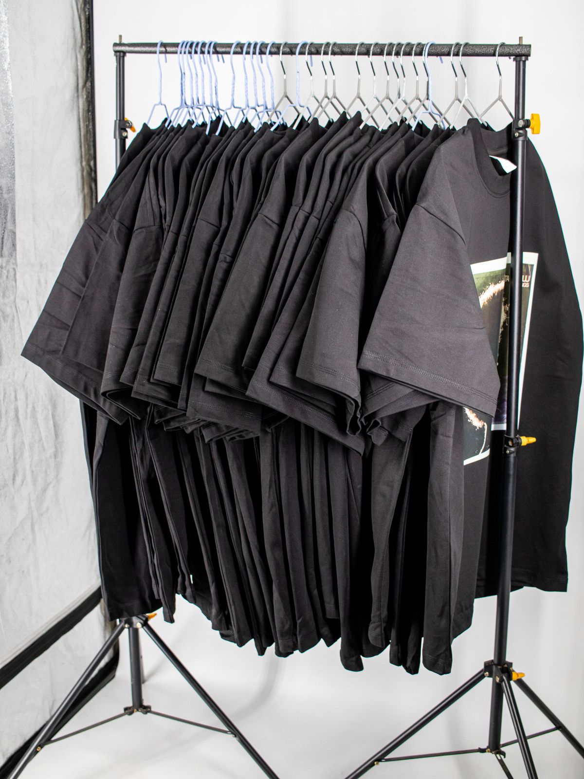 Rack of black heavyweight T-shirts