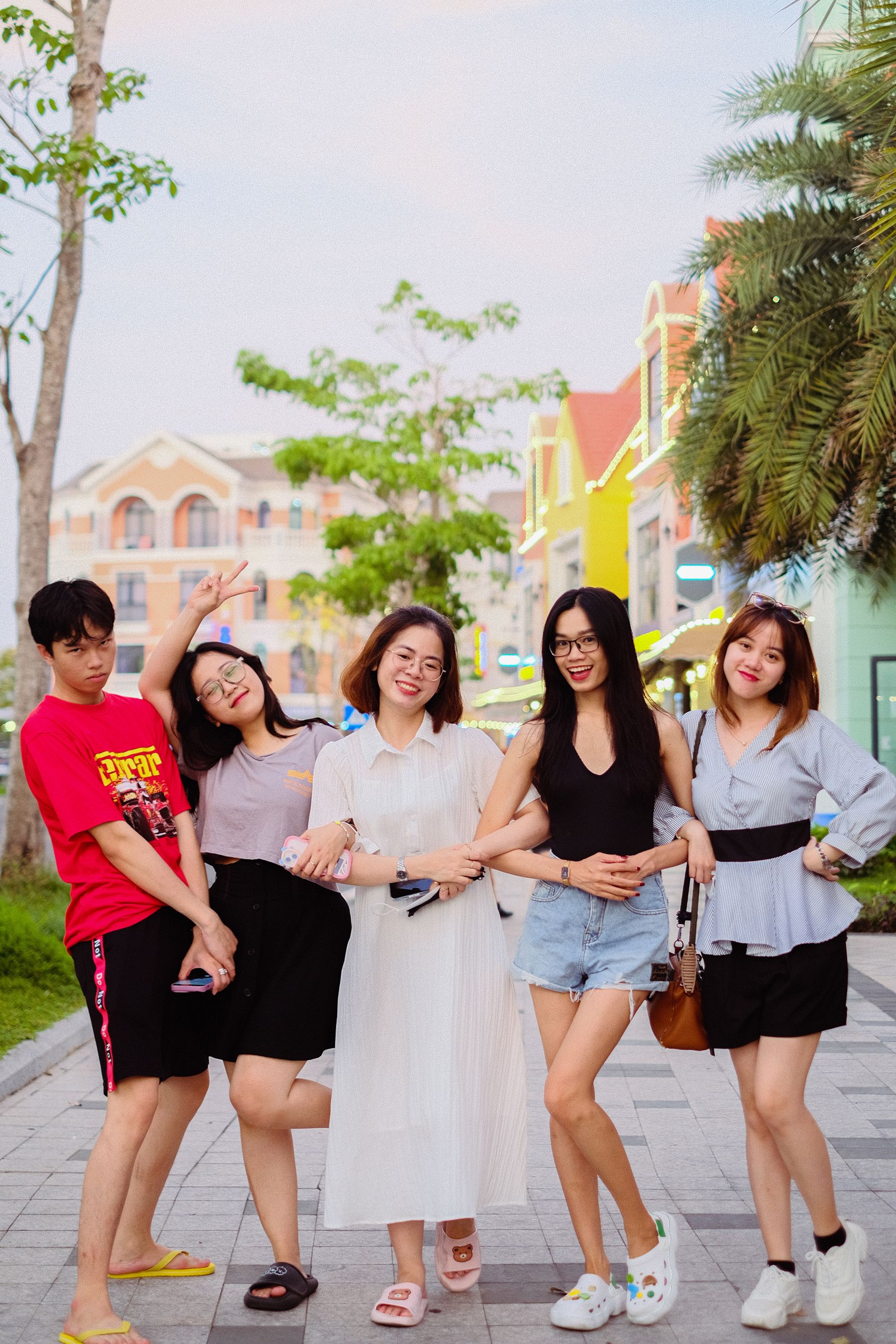Friends together on a colourful city sidewalk