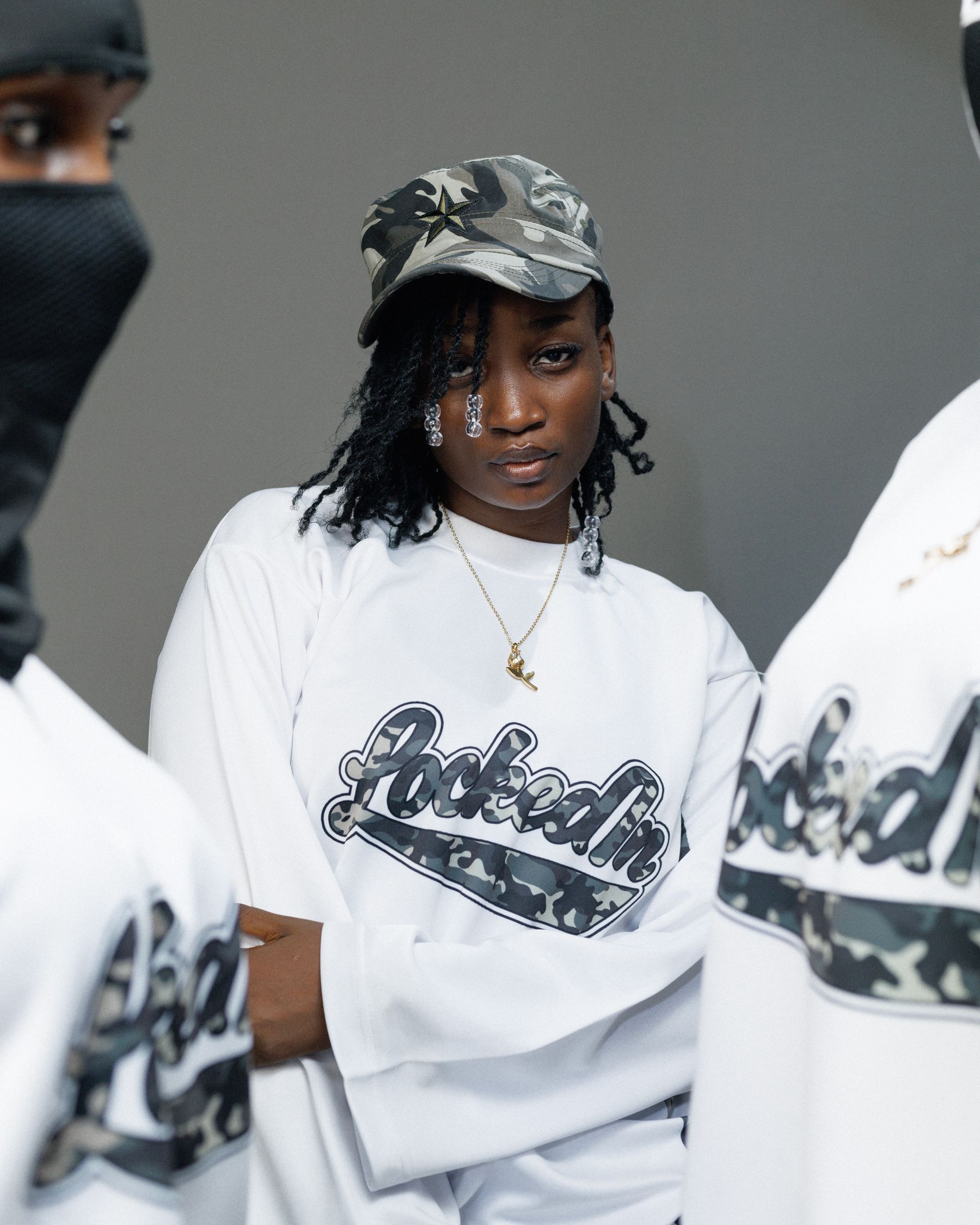 A diverse streetwear group posing together