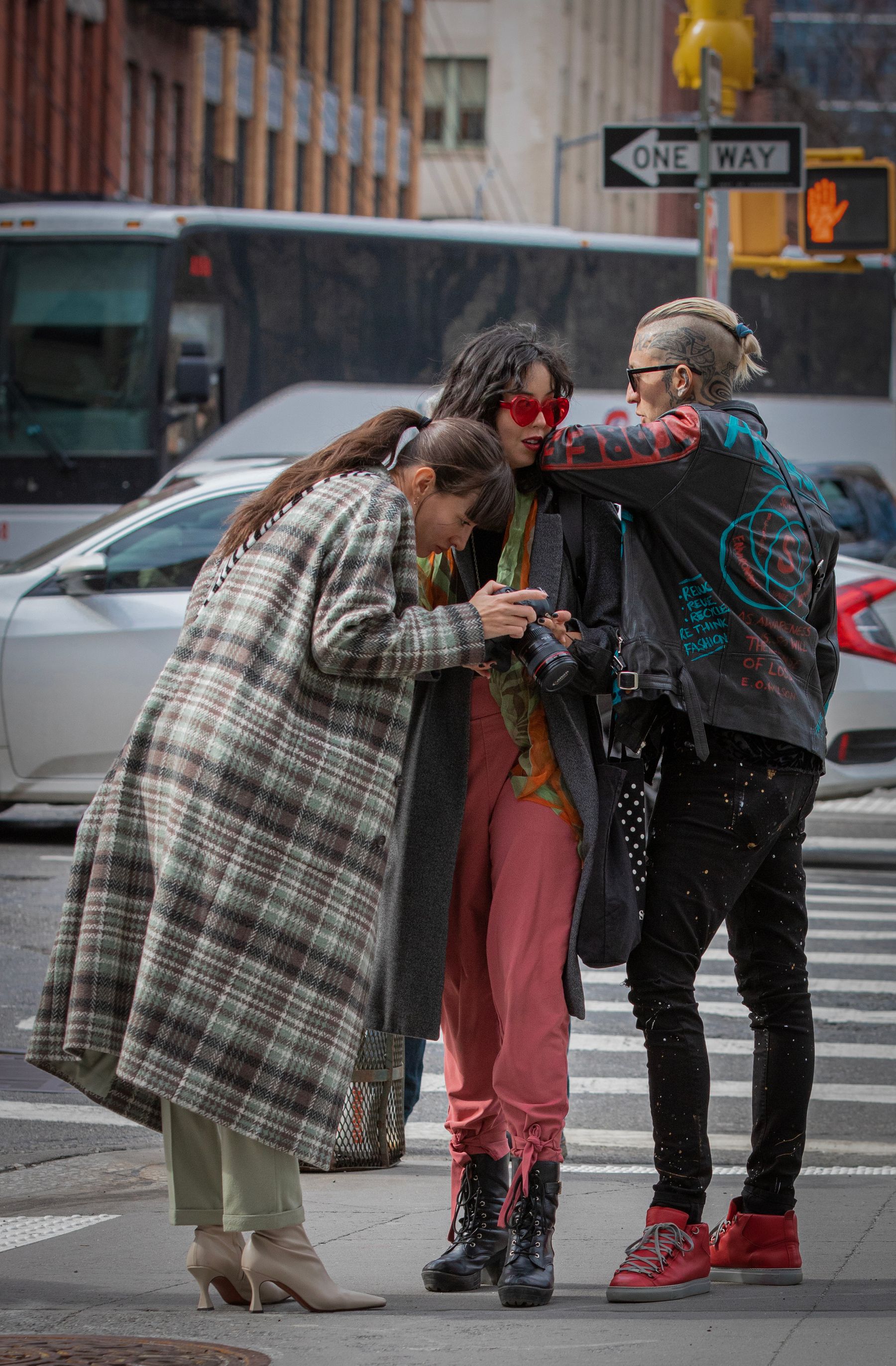 Friends sharing a candid moment on a city sidewalk